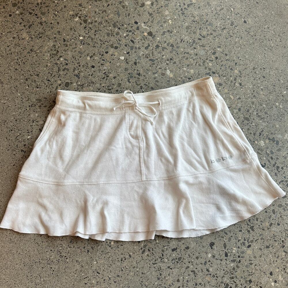 bebe White Mini Skirt with Ruffle Hem